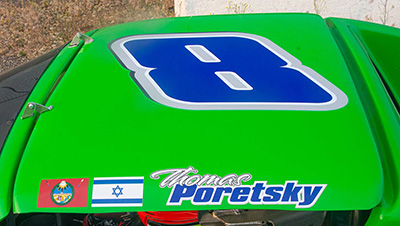  the top of Thomas's car showing his name, number 8, and the Israeli and Quechan flags 